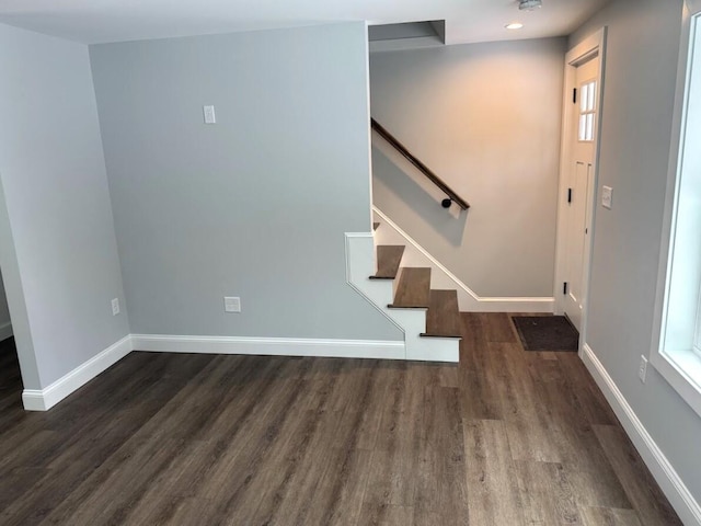 foyer entrance with dark hardwood / wood-style floors