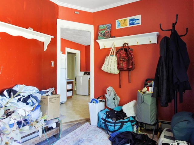 interior space with washer / dryer and crown molding