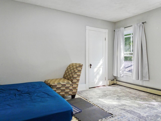 bedroom with a baseboard heating unit