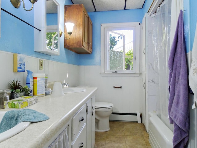 full bathroom featuring a baseboard radiator, tile patterned floors, vanity, toilet, and shower / tub combo with curtain