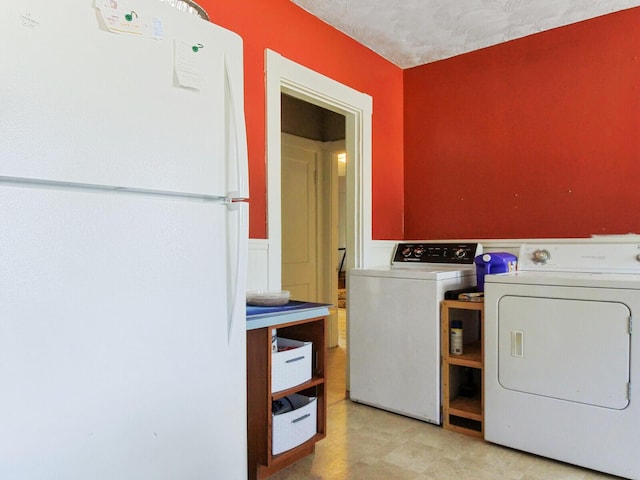 laundry room featuring washer and clothes dryer