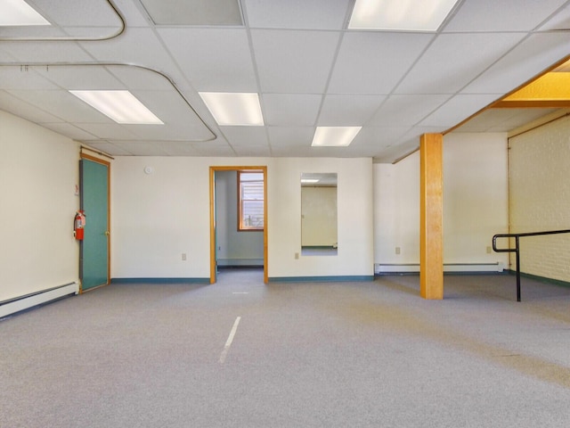 basement with light carpet and a baseboard radiator