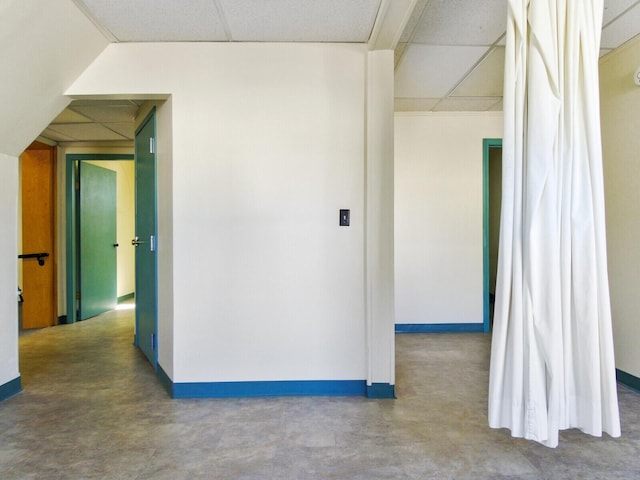 hallway with a drop ceiling