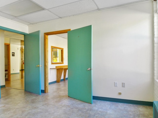 unfurnished room with a paneled ceiling