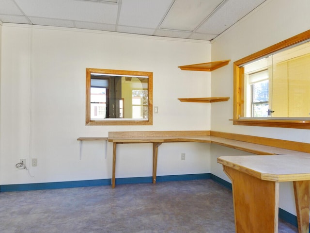 interior space featuring a drop ceiling