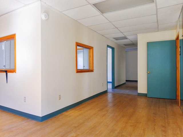 unfurnished room featuring a paneled ceiling and wood-type flooring