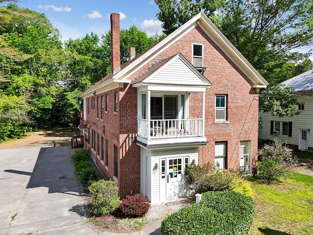 view of front of home with a balcony