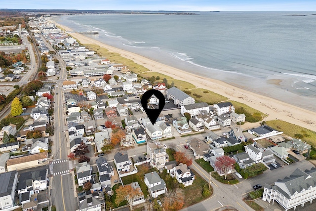 aerial view with a water view and a beach view