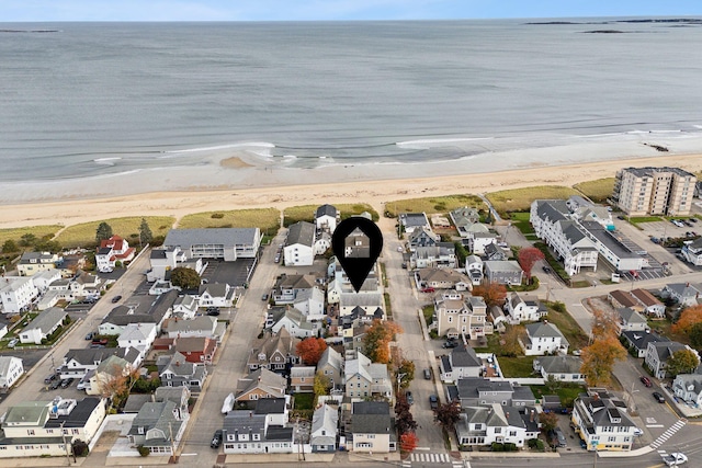 aerial view with a water view and a view of the beach