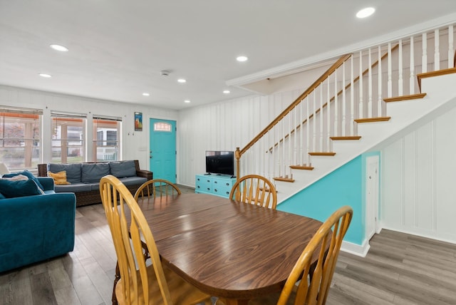 dining space with hardwood / wood-style flooring