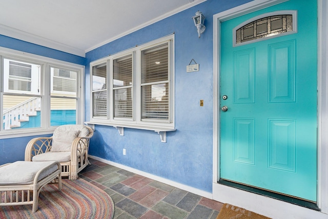 view of exterior entry featuring covered porch