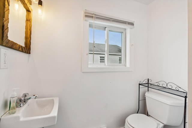 bathroom with toilet and sink