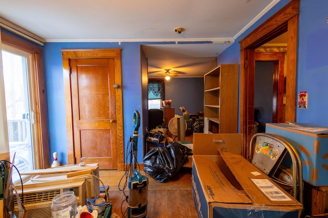 office space with ceiling fan, ornamental molding, and hardwood / wood-style floors