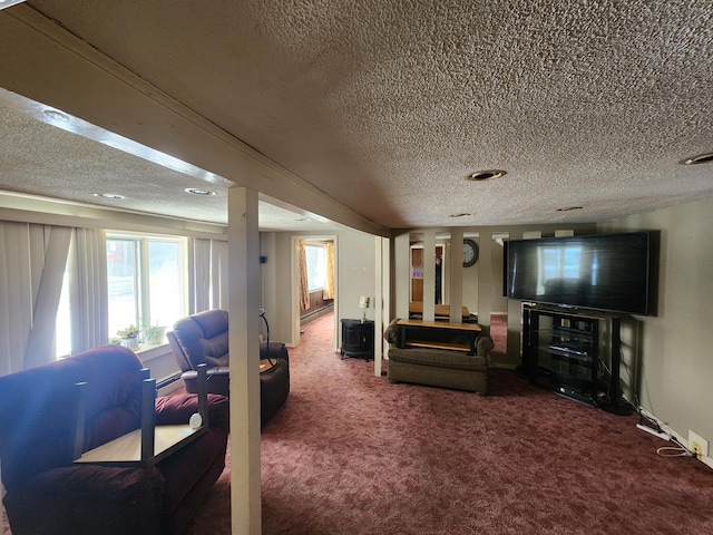 carpeted living room with a textured ceiling