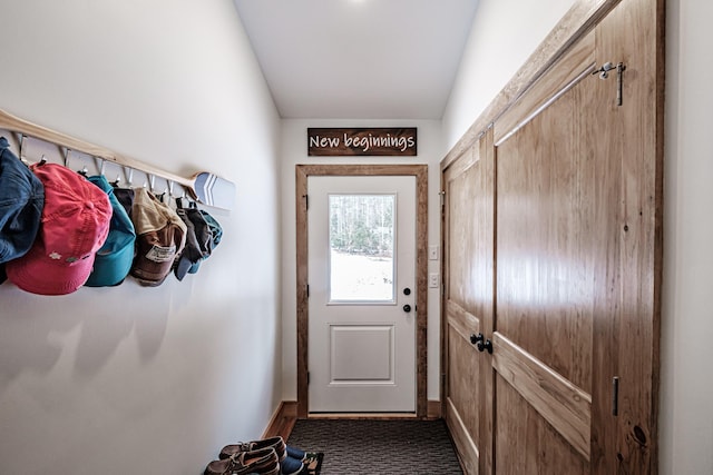 entryway with vaulted ceiling