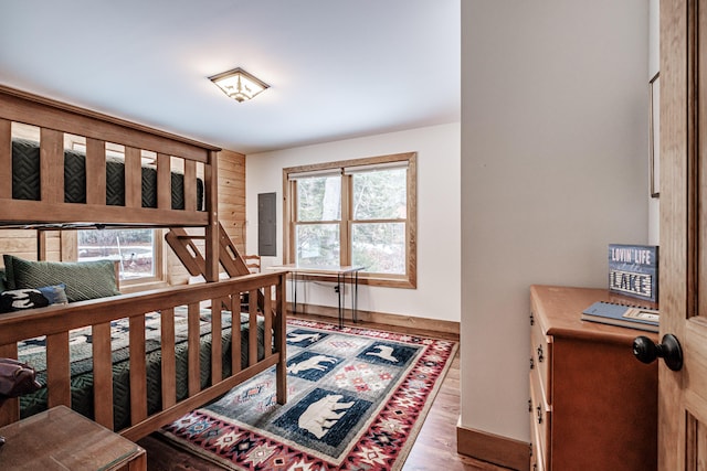 bedroom with hardwood / wood-style flooring