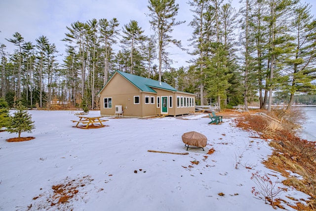 exterior space with an outdoor fire pit