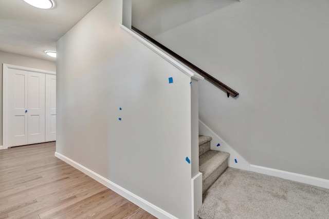 staircase with wood-type flooring