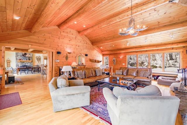 living room with wooden ceiling, vaulted ceiling with beams, a chandelier, and light wood-type flooring