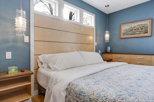 bedroom with hardwood / wood-style floors