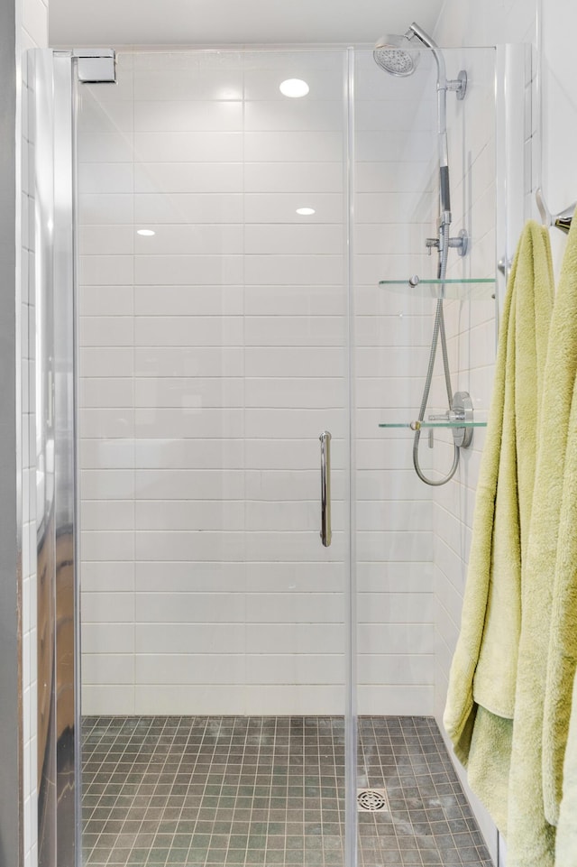 bathroom with a shower with shower door