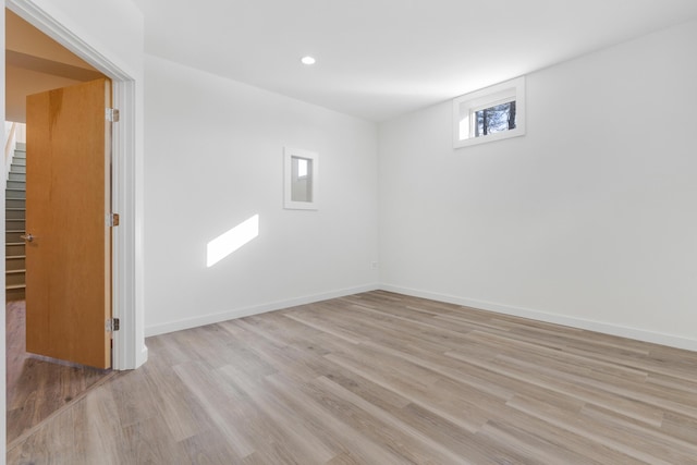 unfurnished room with light hardwood / wood-style flooring