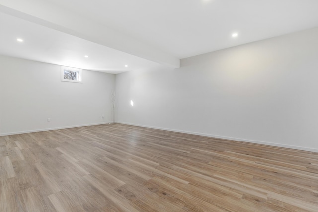 spare room with light hardwood / wood-style floors