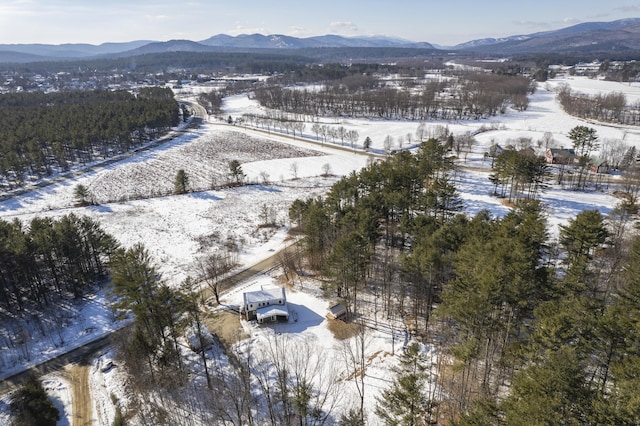 snowy aerial view featuring a mountain view