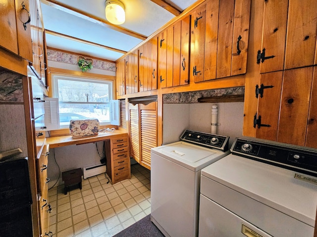 laundry area with cabinets, washing machine and clothes dryer, and a baseboard radiator