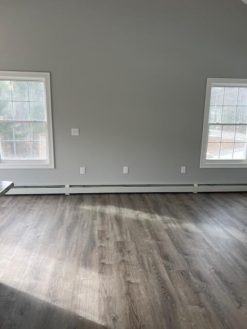 spare room with dark hardwood / wood-style floors