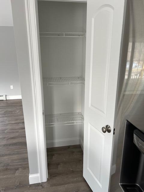 closet with a baseboard radiator