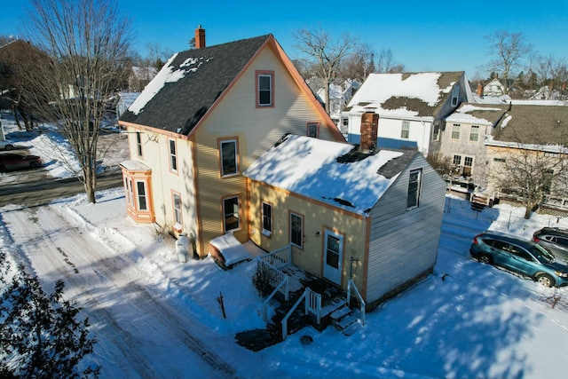 view of snow covered house