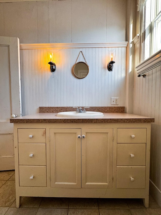 bathroom with tile patterned flooring and sink