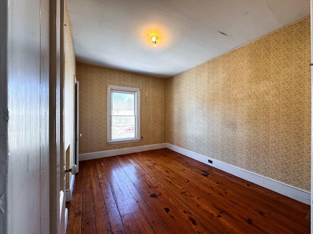 empty room with wood-type flooring