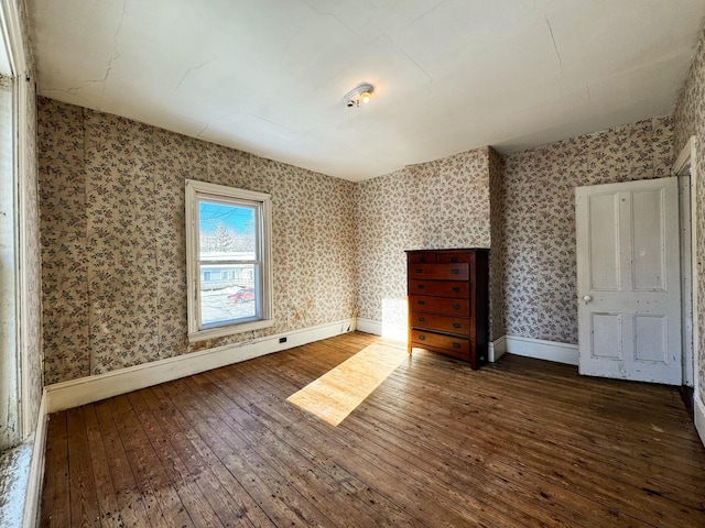 unfurnished bedroom featuring dark wood-type flooring