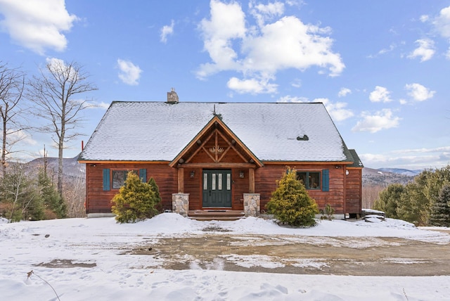 log cabin featuring a mountain view