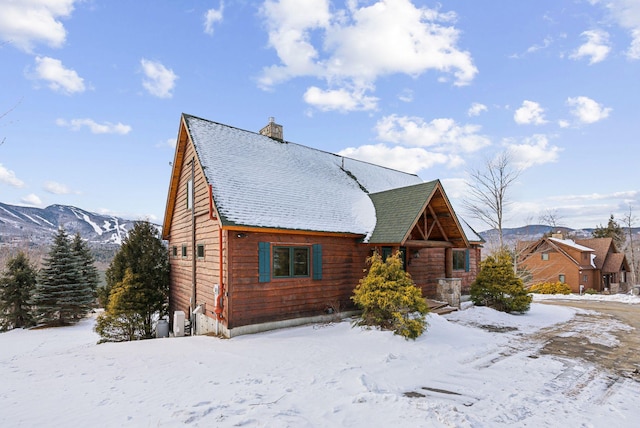 cabin featuring a mountain view