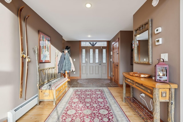 entrance foyer with a baseboard heating unit