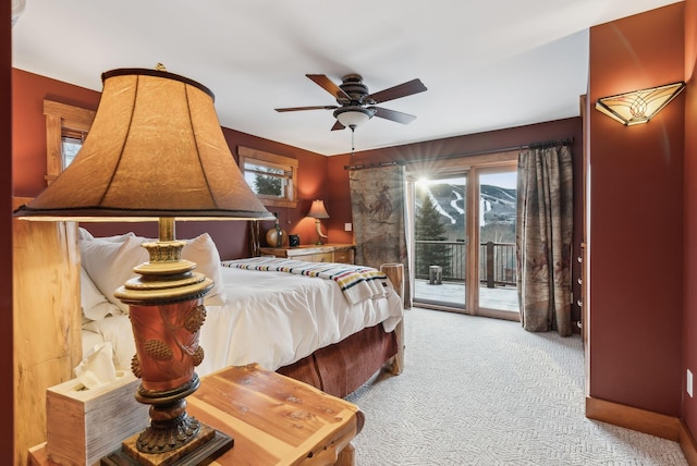 carpeted bedroom with access to outside and ceiling fan