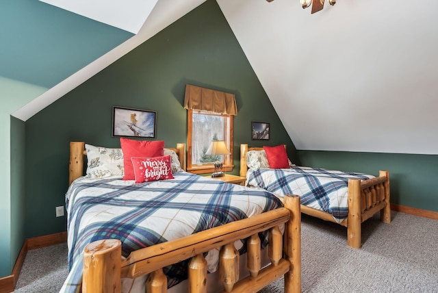 carpeted bedroom featuring lofted ceiling