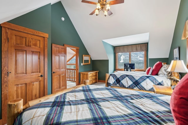 bedroom featuring ceiling fan, carpet floors, and vaulted ceiling