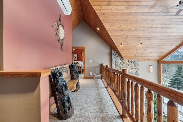 hall featuring lofted ceiling, an AC wall unit, wood ceiling, and light carpet