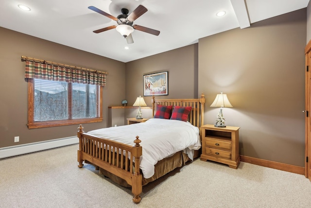 bedroom with ceiling fan, a baseboard radiator, and carpet flooring