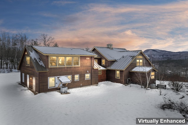 snow covered property featuring a mountain view