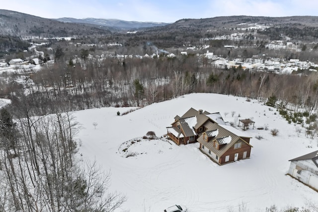 snowy aerial view featuring a mountain view