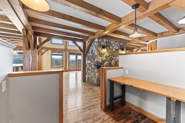 interior space featuring beamed ceiling and hardwood / wood-style flooring