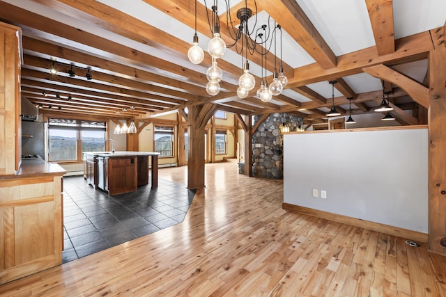 interior space featuring beam ceiling and dark hardwood / wood-style floors