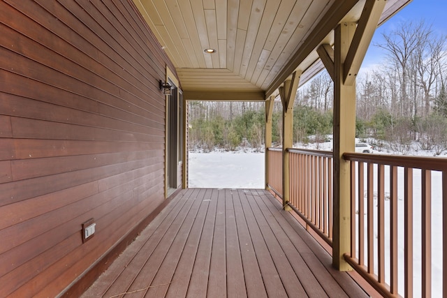 view of snow covered deck