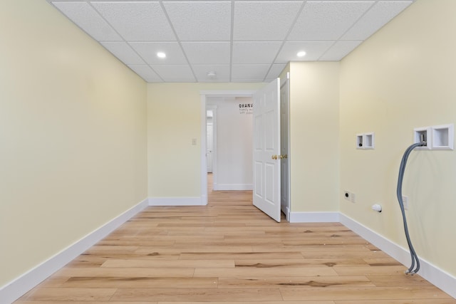 washroom with washer hookup, light hardwood / wood-style flooring, electric dryer hookup, and hookup for a gas dryer