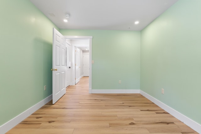 spare room featuring light wood-type flooring